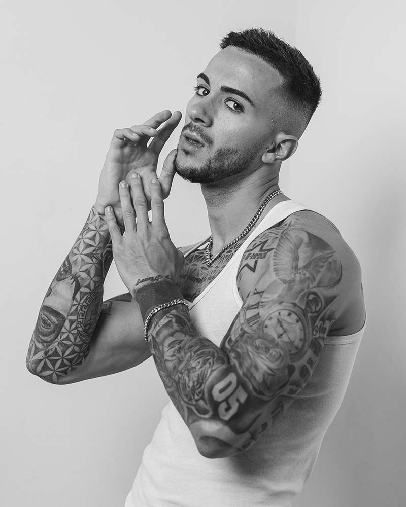 tattooed man model in black and white photography