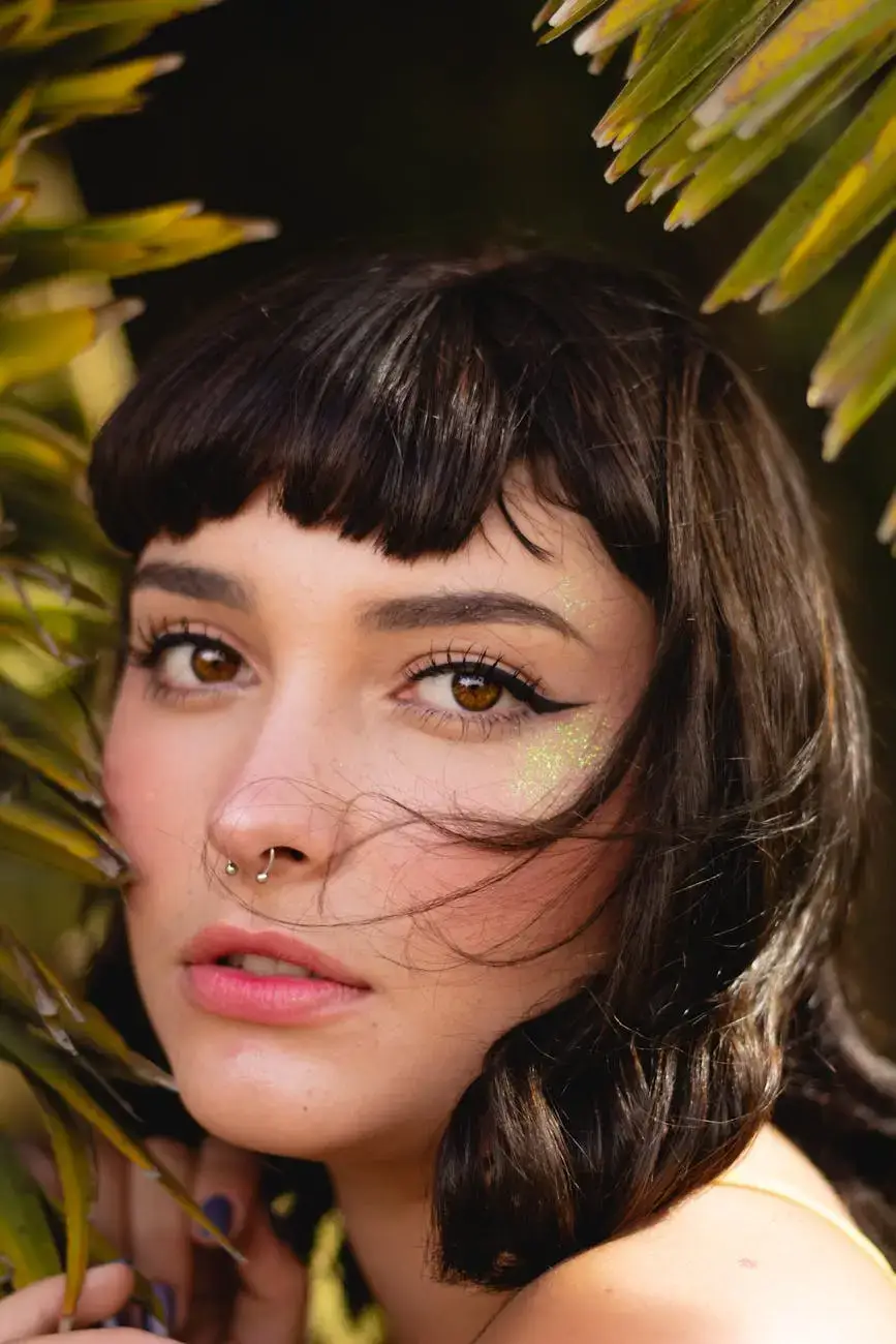 woman standing beside palm tree