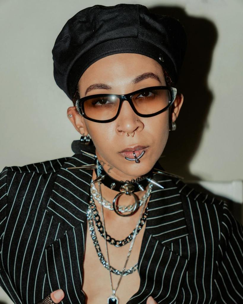 person wearing jewelry and sunglasses